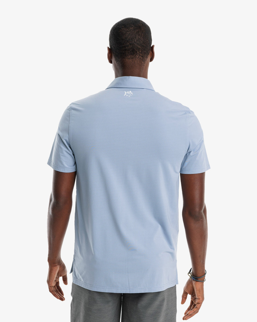The model back view of the Men's Sawgrass Stripe brrr°®-eeze Performance Polo Shirt by Southern Tide - Blue Ridge