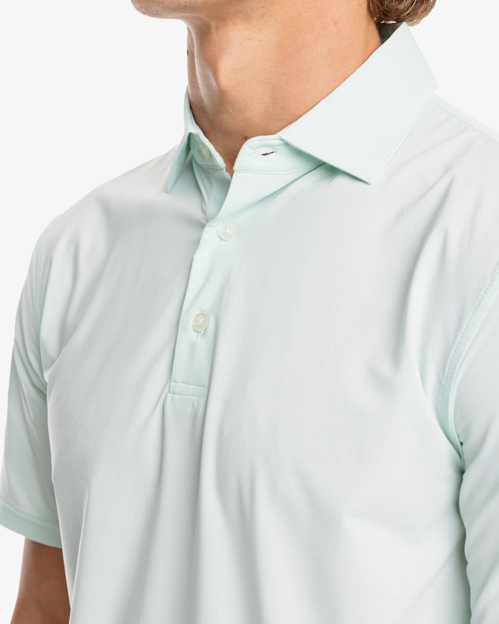 The model detail view of the Men's Sawgrass Stripe brrr°®-eeze Performance Polo Shirt by Southern Tide - Mist Green