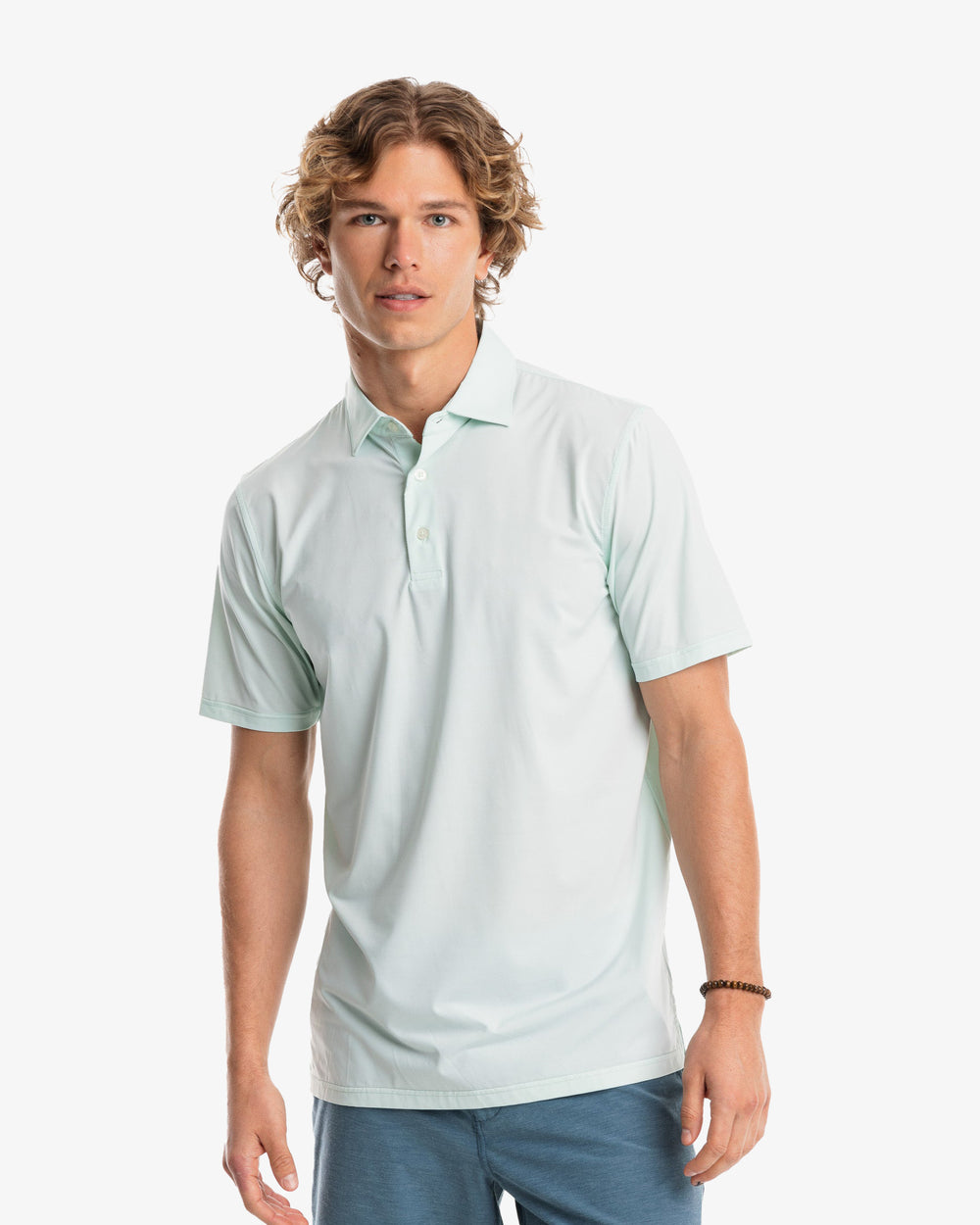 The model front view of the Men's Sawgrass Stripe brrr°®-eeze Performance Polo Shirt by Southern Tide - Mist Green