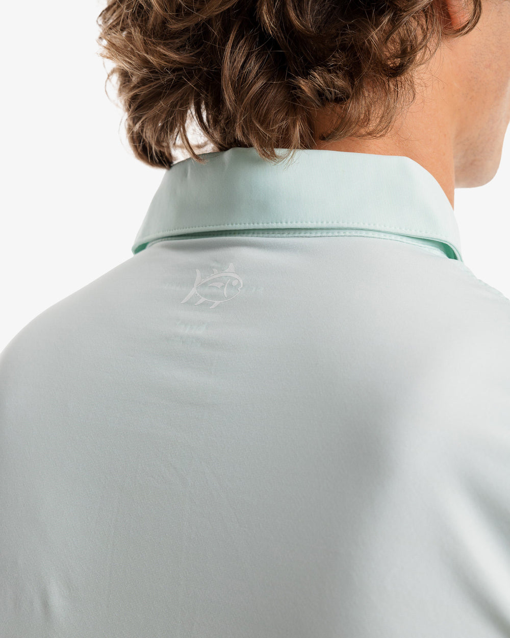 The model yoke view of the Men's Sawgrass Stripe brrr°®-eeze Performance Polo Shirt by Southern Tide - Mist Green