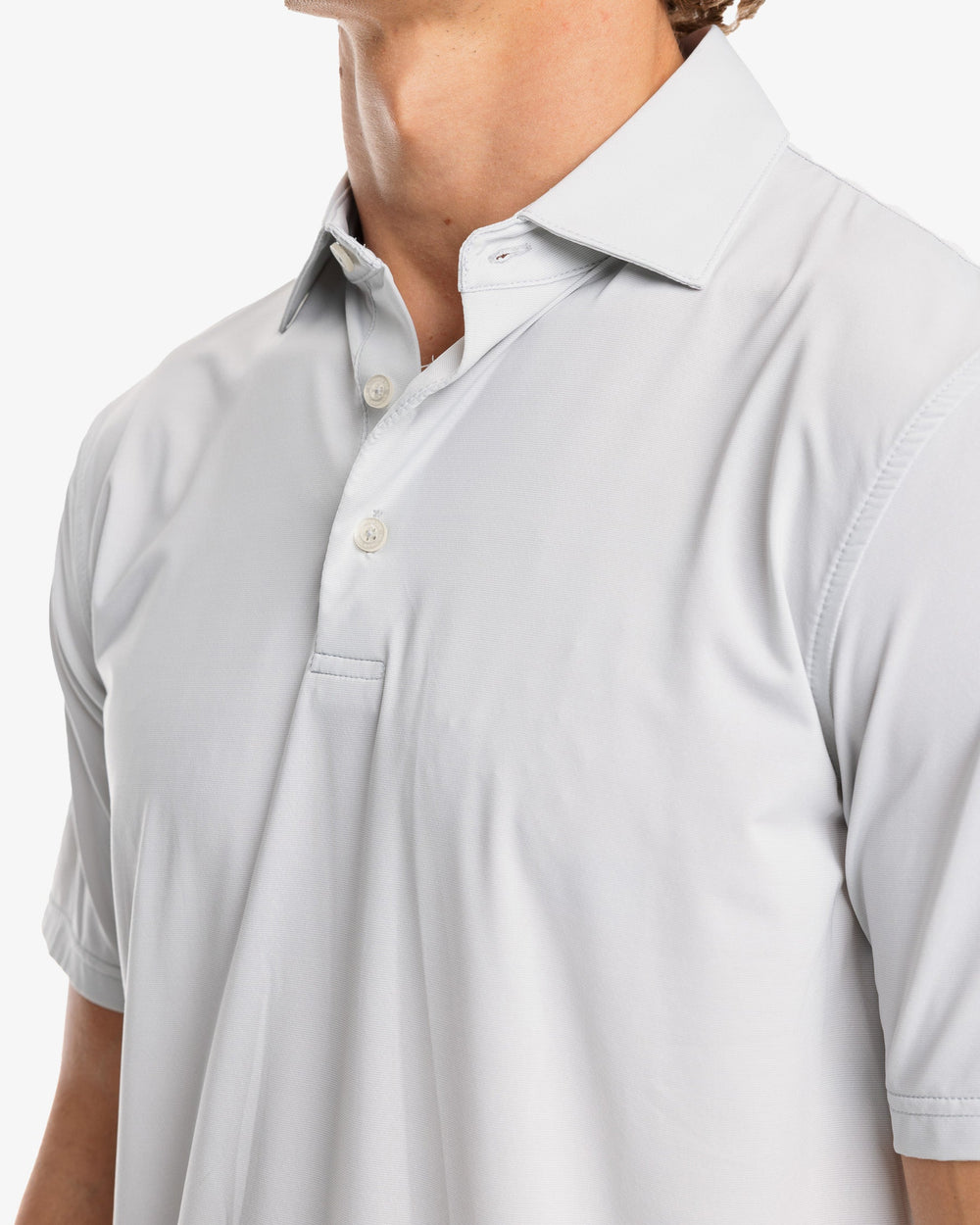 The model detail view of the Men's Sawgrass Stripe brrr°®-eeze Performance Polo Shirt by Southern Tide - Seagull Grey