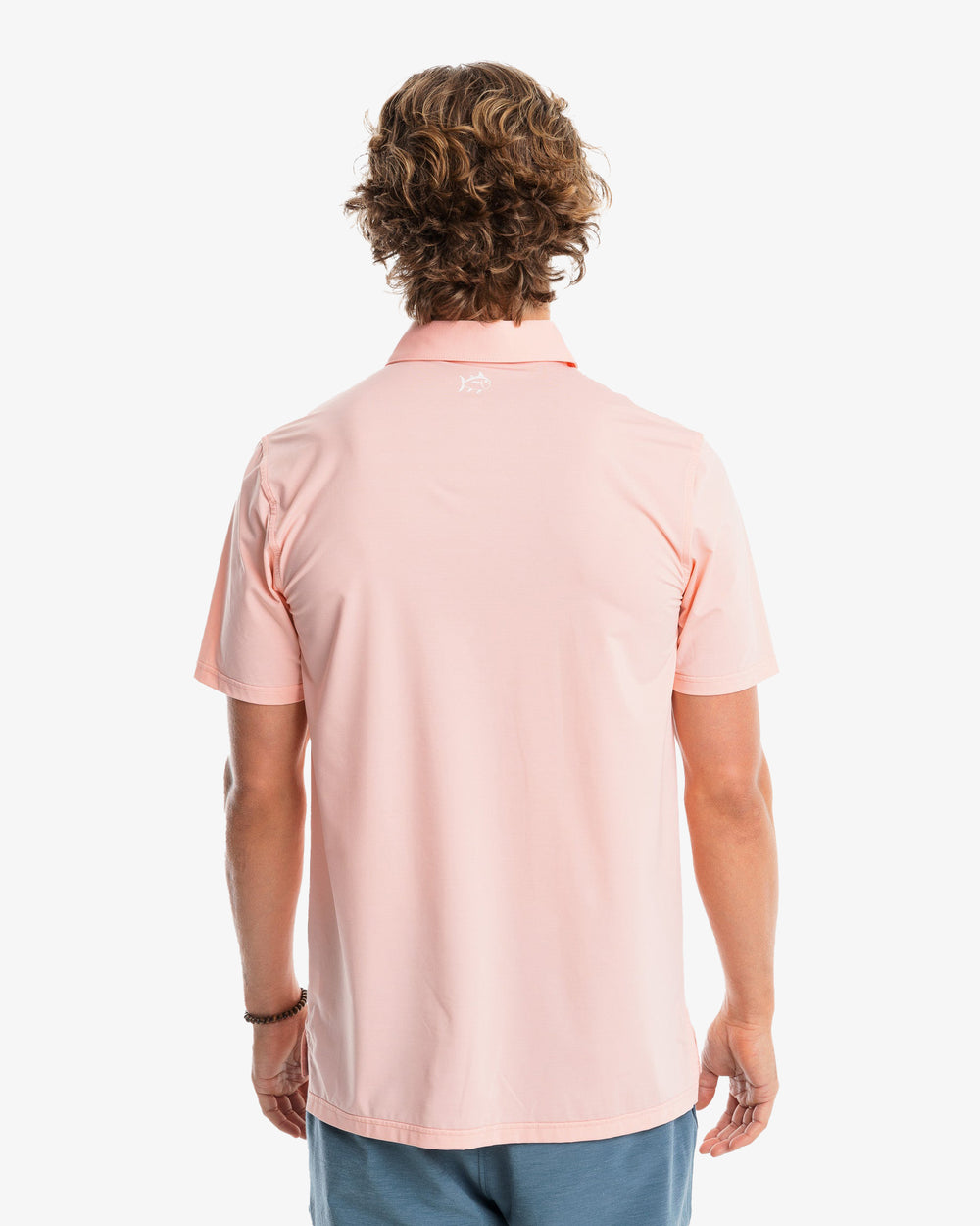 The model back view of the Men's Sawgrass Stripe brrr°®-eeze Performance Polo Shirt by Southern Tide - Sunbaked Sand