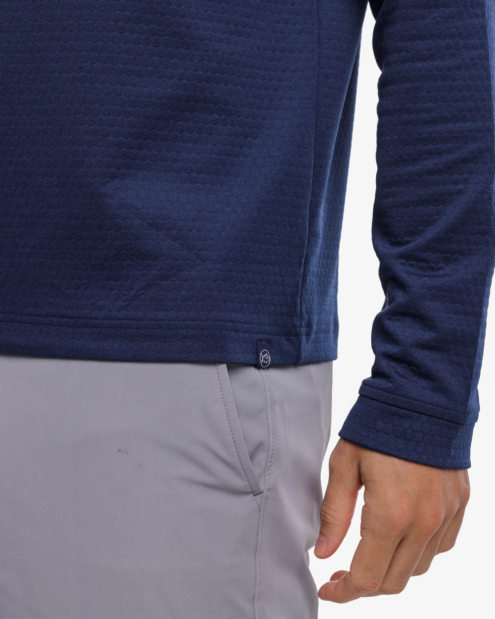 The label detail view of the Southern Tide Scuttle Heather Quarter Zip Pullover by Southern Tide - Heather True Navy
