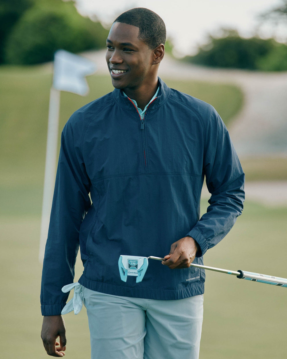 The lifestyle view of the Southern Tide Shoreline Performance Pullover by Southern Tide - True Navy