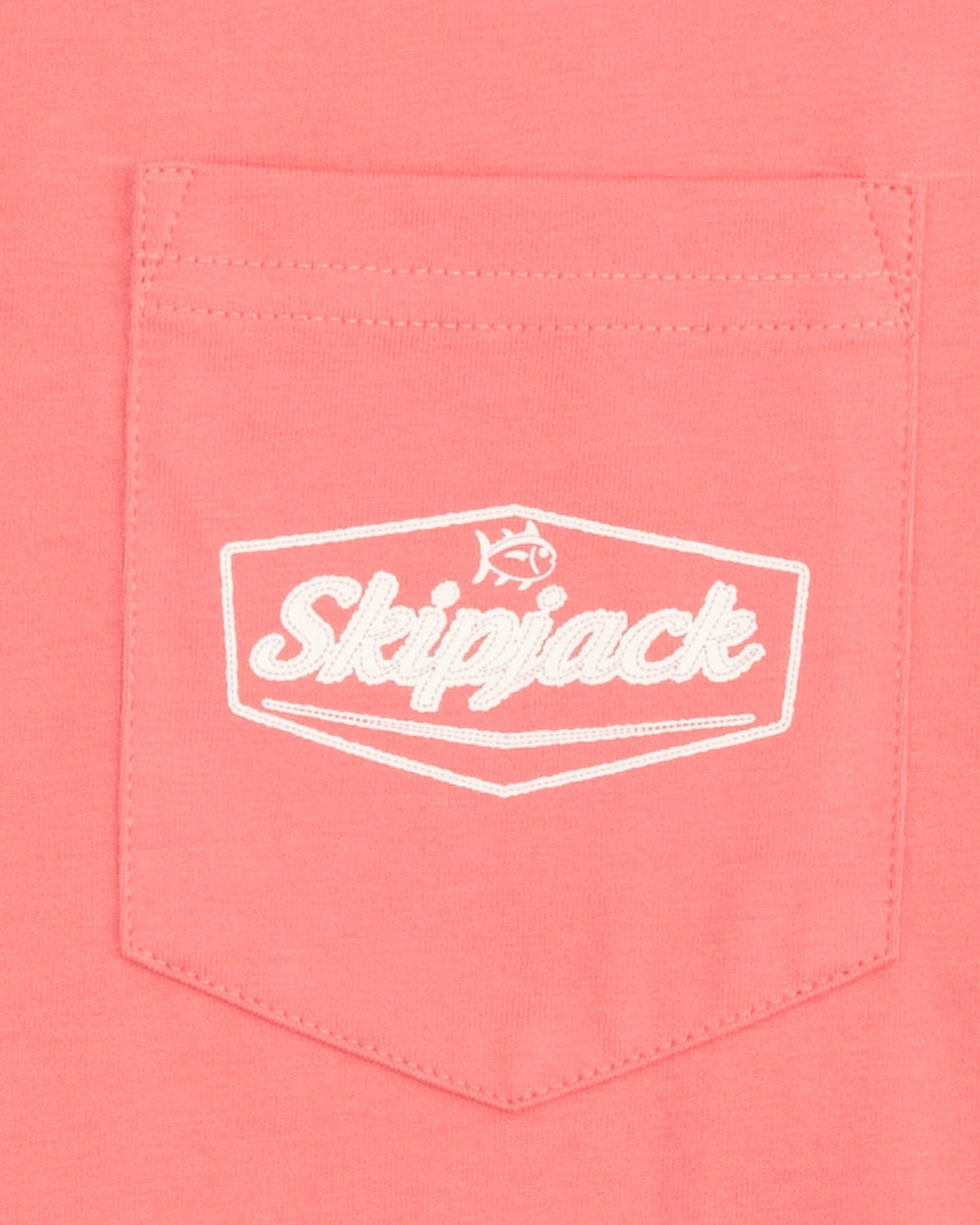 The detail view of the Southern Tide Skipjack Patch T-Shirt by Southern Tide - Sunkist Coral