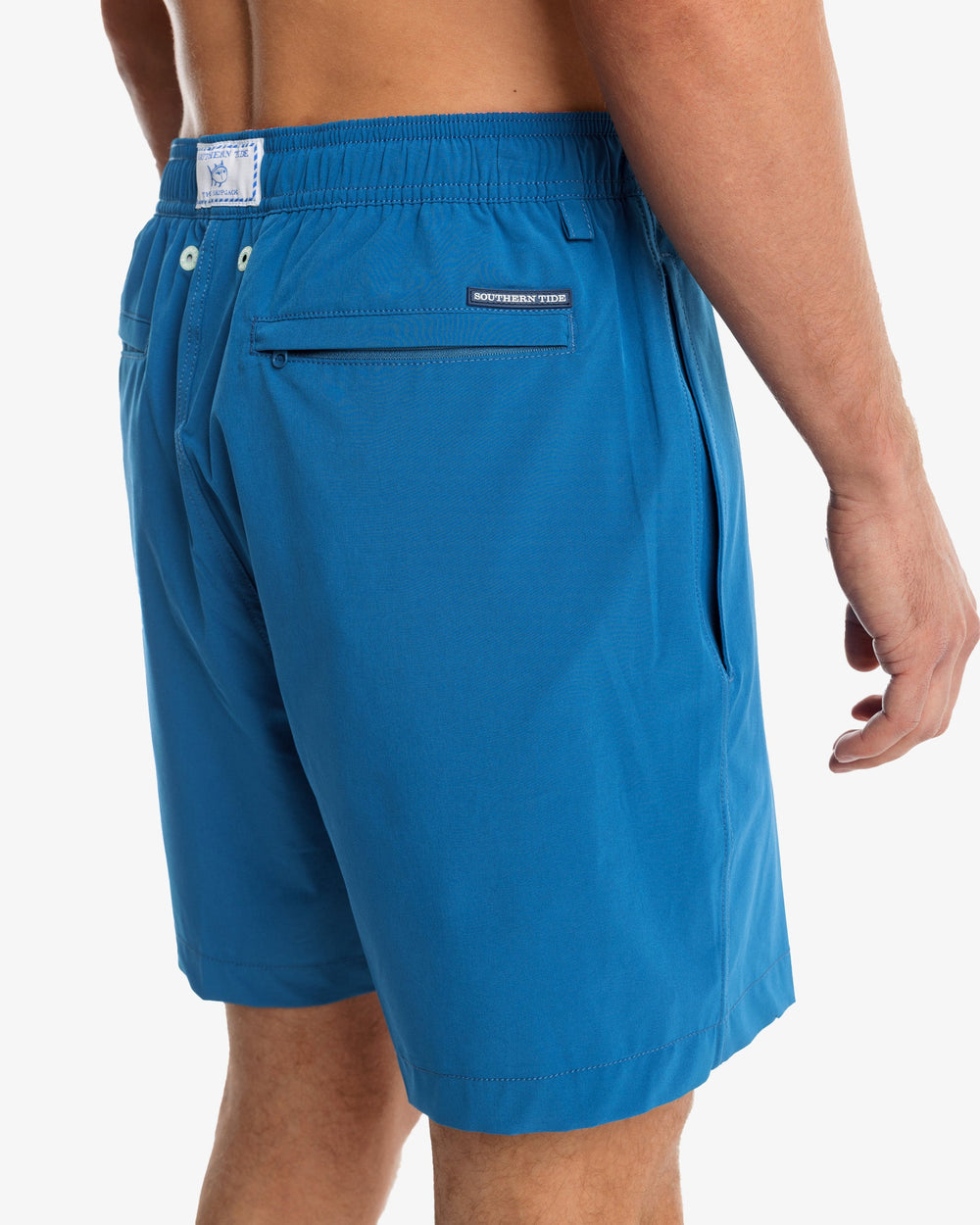 The model detail view of the Men's Solid Swim Trunk by Southern Tide - Blue Sapphire