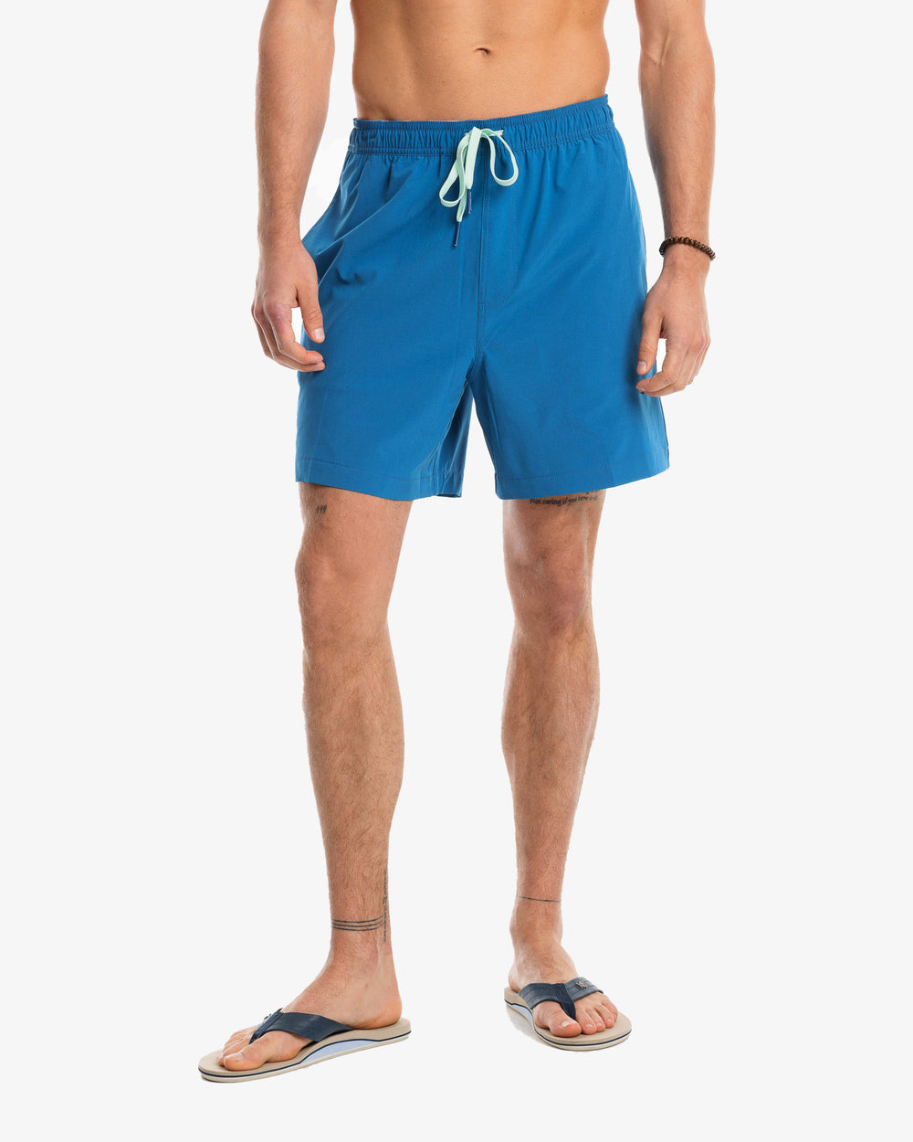 The model front view of the Men's Solid Swim Trunk by Southern Tide - Blue Sapphire