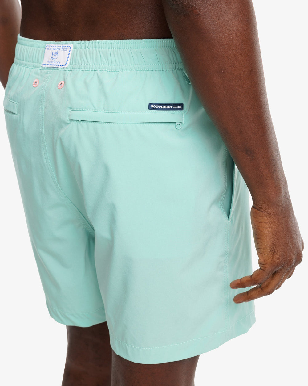 The model detail view of the Men's Solid Swim Trunk by Southern Tide - Isle of Pines