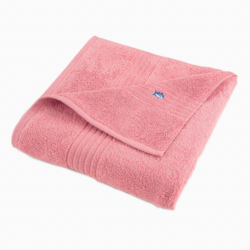 The front view of the Performance 5.0 Bath Towel by Southern Tide - Geranium Pink - Bath Towel