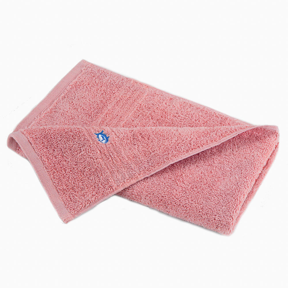 The front view of the Performance 5.0 Hand Towel by Southern Tide - Geranium Pink - Hand Towel