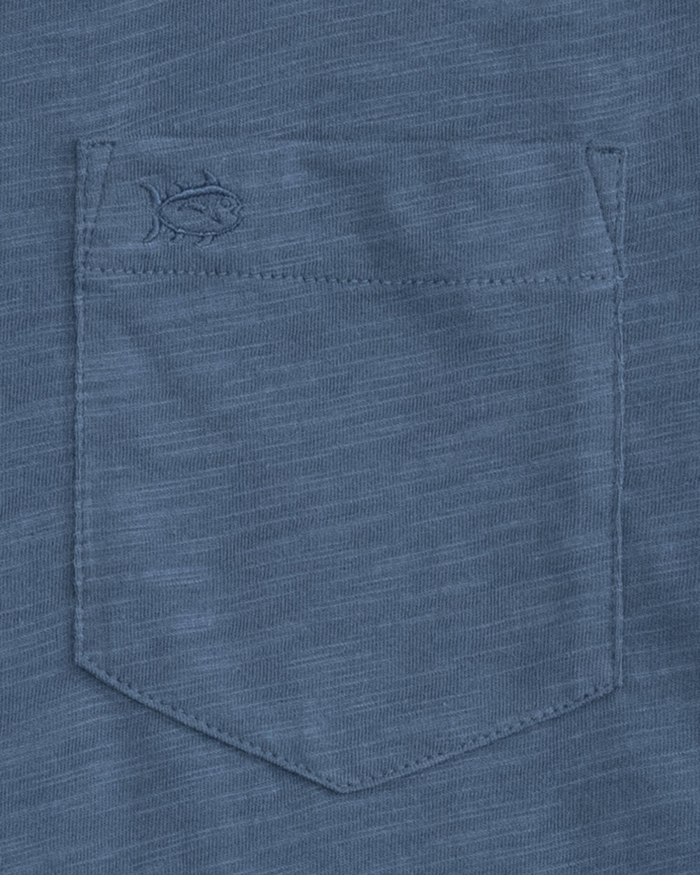 The pocket of the Men's Sun Farer Long Sleeve T-Shirt by Southern Tide - Dark Denim