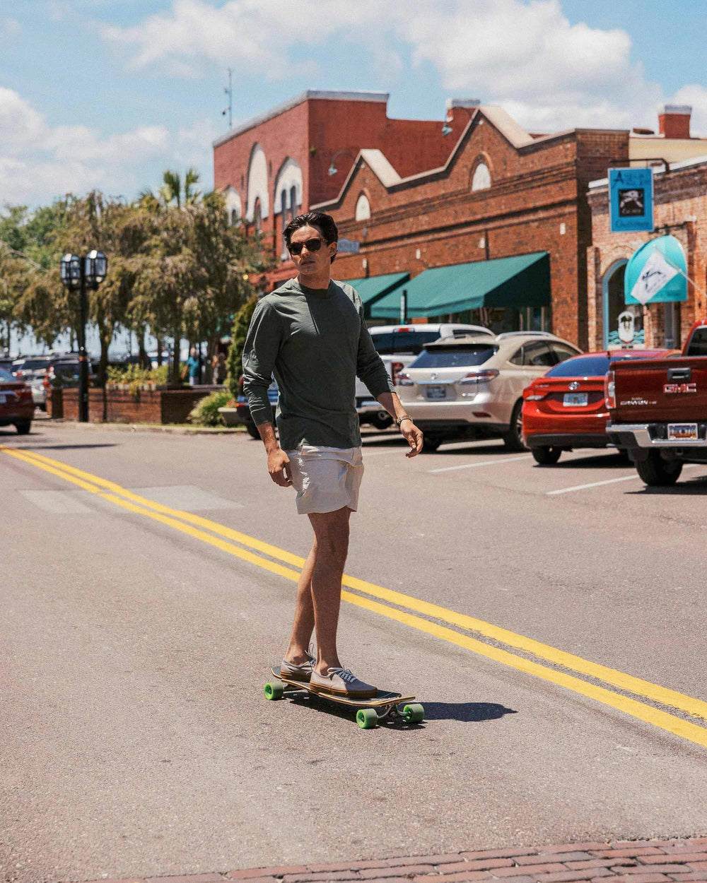 The lifestyle view of the Men's Sun Farer Long Sleeve T-Shirt by Southern Tide - Forest Night