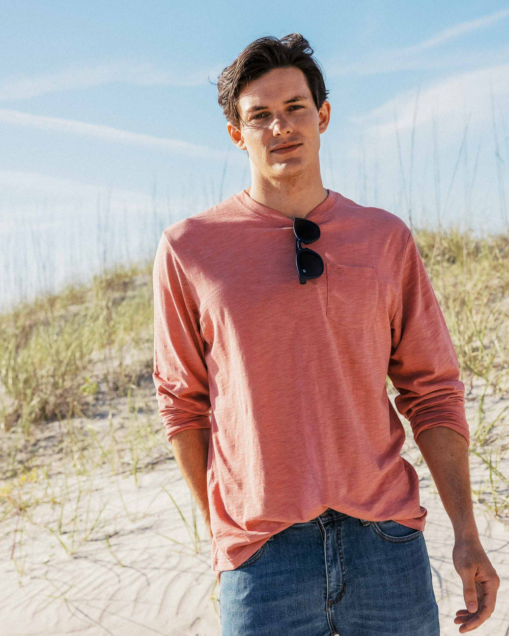 The lifestyle view of the Men's Sun Farer Long Sleeve T-Shirt by Southern Tide - Spanish Rose