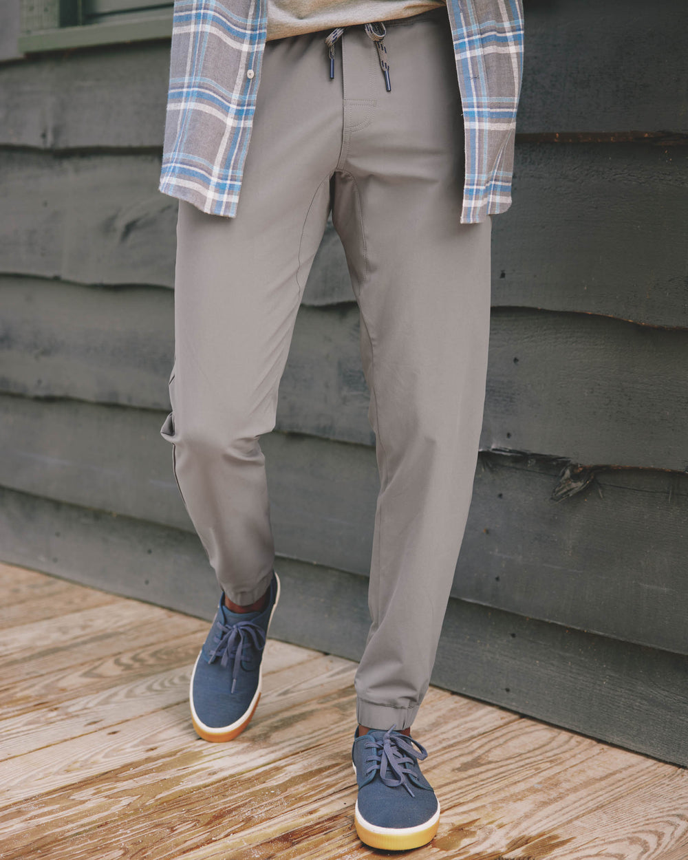 The front lifestyle view of the The Excursion Performance Jogger by Southern Tide - Smoked Pearl