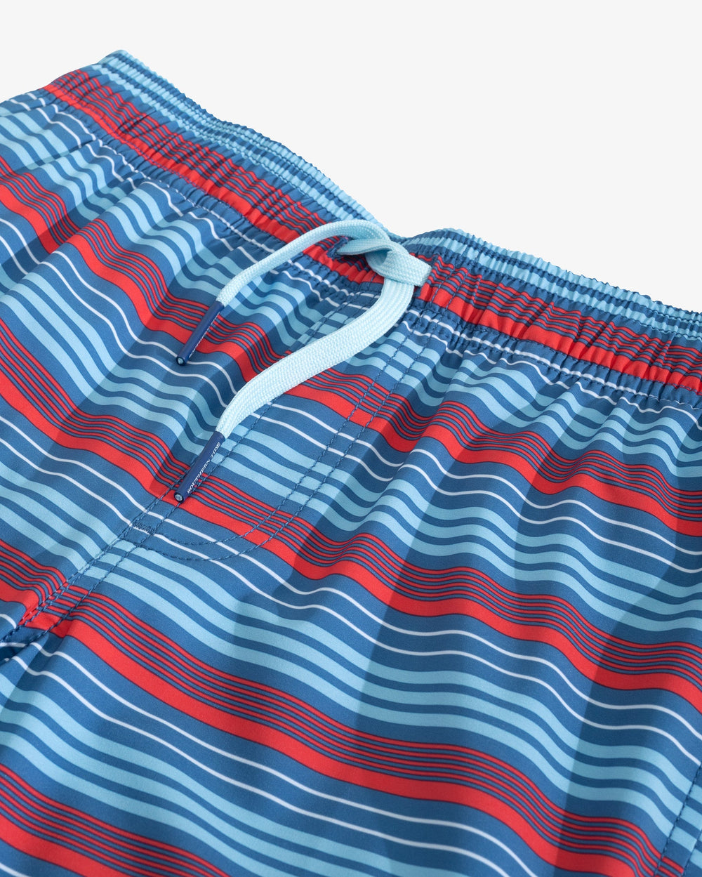 The detail view of the Boys Largo Stripe Swim Trunk by Southern Tide - Deep Water