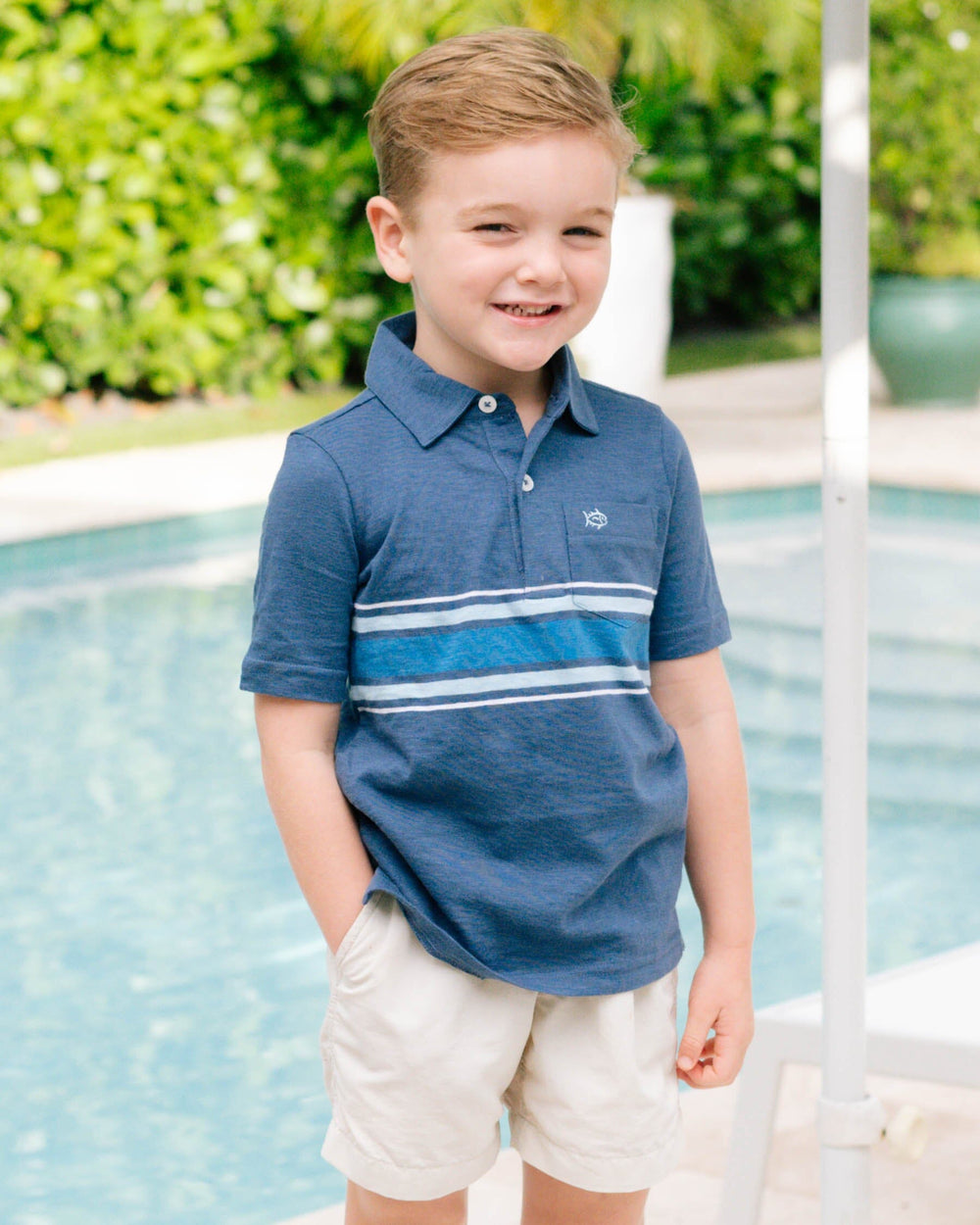 The lifestyle view of the Southern Tide Youth Mesa Sun Farer Polo Shirt by Southern Tide - Aged Denim