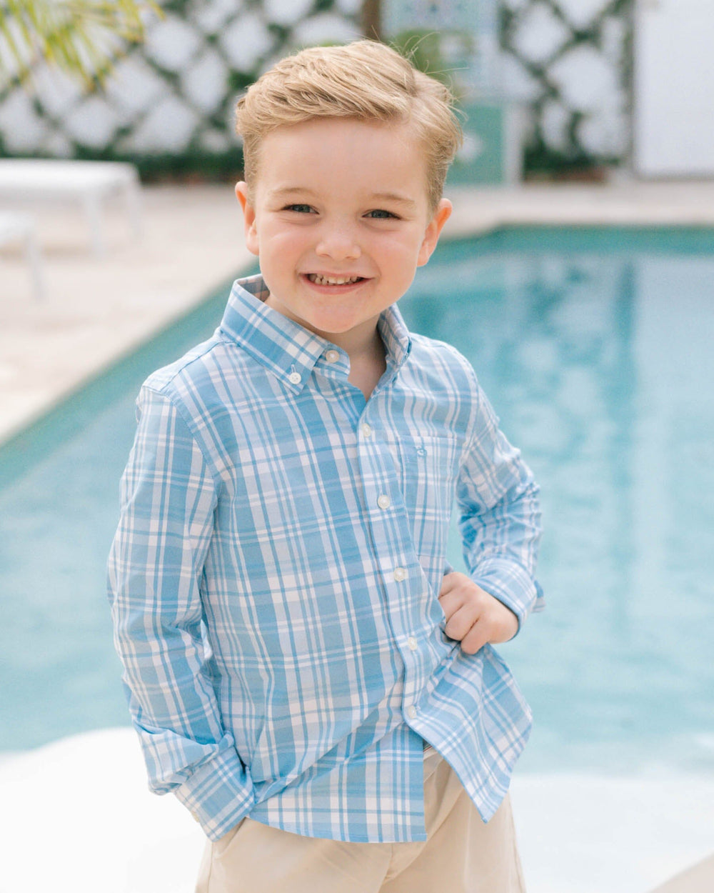The lifestyle view of the Southern Tide Youth Palm Canyon Plaid Intercoastal Sport Shirt by Southern Tide - Rain Water